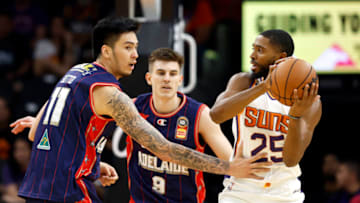 PHOENIX, ARIZONA - OCTOBER 02: Kai Sotto #11 of the Adelaide 36ers defends Mikal Bridges #25 of the Phoenix Suns during the first half at Footprint Center on October 02, 2022 in Phoenix, Arizona. NOTE TO USER: User expressly acknowledges and agrees that, by downloading and or using this photograph, User is consenting to the terms and conditions of the Getty Images License Agreement. (Photo by Chris Coduto/Getty Images)