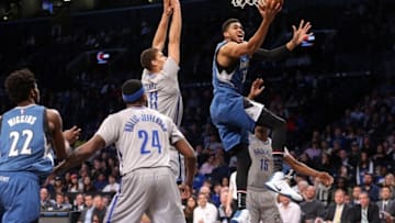 Nov 8, 2016; Brooklyn, NY, USA; Minnesota Timberwolves center Karl-Anthony Towns (32) drives the lane against Brooklyn Nets center Brook Lopez (11) and Brooklyn Nets shooting guard Rondae Hollis-Jefferson (24) during the first quarter at Barclays Center. Mandatory Credit: Brad Penner-USA TODAY Sports