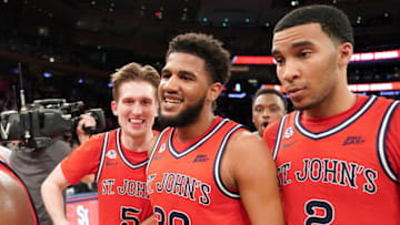 NEW YORK , NY - MARCH 11: LJ Figueroa #30 of the St. John's basketball team walks off the floor with David Caraher #5 and Julian Champagnie #2 after a win of the Big East Conference Men's Basketball Tournament First Round game against the Georgetown Hoyas at Madison Square Garden on March 11, 2020 in New York City. (Photo by Mitchell Layton/Getty Images)