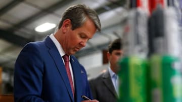 Georgia Governor Brian Kemp signs House Bill 273 which will allow distillers to sale spirits on distillery grounds to individuals and allow breweries to make retail sells on Sundays at the Southern Brewing Company in Athens, Ga., on Wednesday, May 5, 2021.News Joshua L Jones