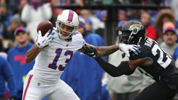 BUFFALO, NY - NOVEMBER 25: Kelvin Benjamin #13 of the Buffalo Bills bobbles a pass but manages to recover and hold on to the ball for the reception in the first quarter during NFL game action as Jalen Ramsey #20 of the Jacksonville Jaguars defends at New Era Field on November 25, 2018 in Buffalo, New York. (Photo by Tom Szczerbowski/Getty Images)