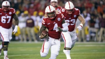 Nov 12, 2016; Lincoln, NE, USA; Nebraska Cornhuskers quarterback Tommy Armstrong Jr. (4) runs against the Minnesota Golden Gophers in the first half at Memorial Stadium. Mandatory Credit: Bruce Thorson-USA TODAY Sports