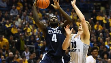 MILWAUKEE, WI - JANUARY 28: Eric Paschall #4 of the Villanova Wildcats is defended by Sam Hauser #10 of the Marquette Golden Eagles during the first half at the BMO Harris Bradley Center on January 28, 2018 in Milwaukee, Wisconsin. (Photo by Stacy Revere/Getty Images)
