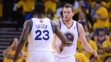 Apr 27, 2014; Oakland, CA, USA; Golden State Warriors forward David Lee (10) celebrates with forward Draymond Green (23) during the second quarter in game four of the first round of the 2014 NBA Playoffs against the Los Angeles Clippers at Oracle Arena. The Warriors defeated the Clippers 118-97. Mandatory Credit: Kyle Terada-USA TODAY Sports
