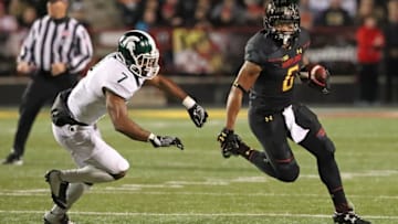 Oct 22, 2016; College Park, MD, USA; Maryland Terrapins running back Ty Johnson (6) runs the ball defended by Michigan State Spartans defensive back Demetrious Cox (7) at Byrd Stadium. Mandatory Credit: Mitch Stringer-USA TODAY Sports