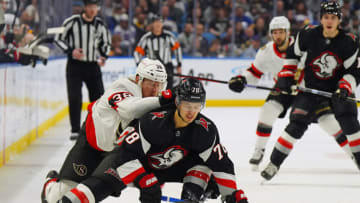 BUFFALO, NY - APRIL 13: Patrick Brown #38 of the Ottawa Senators checks Jacob Bryson #78 of the Buffalo Sabres during the first period at KeyBank Center on April 13, 2023 in Buffalo, New York. (Photo by Kevin Hoffman/Getty Images)