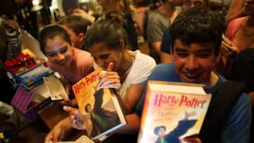 MIAMI - JULY 20: (L-R) Gabi Maseda, Annie Cardelle and Mike Maseda pick up their new copies of "Harry Potter and the Deathly Hallows" after it went on sale at Books and Books July 20, 2007 in Miami, Florida. The book will be the seventh and final volume of the series written by J.K. Rowling. (Photo by Joe Raedle/Getty Images)
