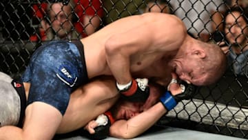 BOSTON, MASSACHUSETTS - OCTOBER 18: (L-R) Joe Lauzon punches Jonathan Pearce in their lightweight bout during the UFC Fight Night event at TD Garden on October 18, 2019 in Boston, Massachusetts. (Photo by Chris Unger/Zuffa LLC via Getty Images)