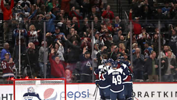 DENVER, COLORADO - FEBRUARY 20: Members of the Colorado Avalanche celebrate a goal against the Winnipeg Jets in the third period at the Pepsi Center on February 20, 2019 in Denver, Colorado. (Photo by Matthew Stockman/Getty Images)