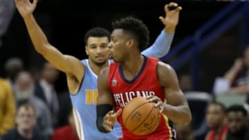 Oct 26, 2016; New Orleans, LA, USA; New Orleans Pelicans guard Buddy Hield (24) is defended by Denver Nuggets guard Jamal Murray (27) in the first quarter at the Smoothie King Center. Mandatory Credit: Chuck Cook-USA TODAY Sports