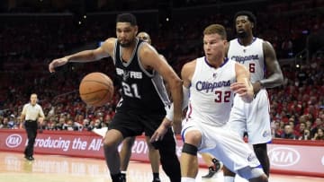 Apr 19, 2015; Los Angeles, CA, USA; San Antonio Spurs forward Tim Duncan (21) and Los Angeles Clippers forward Blake Griffin (32) go for a loose ball during the fourth quarter in game one of the first round of the NBA Playoffs at Staples Center. Mandatory Credit: Richard Mackson-USA TODAY Sports