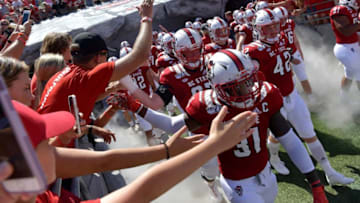 RALEIGH, NORTH CAROLINA - AUGUST 31: The North Carolina State Wolfpack takes the field for a game against the East Carolina Pirates at Carter-Finley Stadium on August 31, 2019 in Raleigh, North Carolina. (Photo by Grant Halverson/Getty Images)