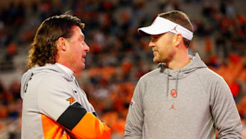 STILLWATER, OK - NOVEMBER 30: Head coach Mike Gundy of the Oklahoma State Cowboys talks with head coach Lincoln Riley of the Oklahoma Sooners before their Bedlam game on November 30, 2019 at Boone Pickens Stadium in Stillwater, Oklahoma. OU won 34-16. (Photo by Brian Bahr/Getty Images)