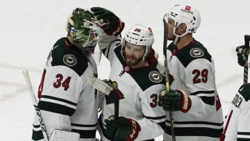 Minnesota Wild goalie Kaapo Kahkonen and right winger Ryan Hartman celebrate a win over the Chicago Blackhawks on Friday at the United Center.(David Banks-USA TODAY Sports)