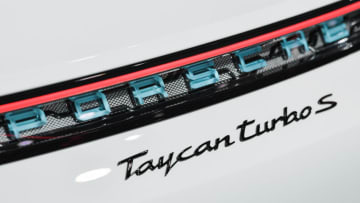 The logo of a Porsche Taycan turbos S electric car as seen during its presentation as world premiere on August 4, 2019 in a hall of the airfield of Neuhardenberg, north-east of Berlin. - The first pure electric model is presented at the same time on three continents and will be delivered starting the new year, with the USA ahead. (Photo by Patrick Pleul / dpa / AFP) / Germany OUT (Photo credit should read PATRICK PLEUL/DPA/AFP via Getty Images)