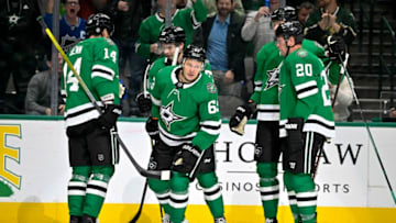 Feb 27, 2023; Dallas, Texas, USA; Dallas Stars right wing Evgenii Dadonov (63) and center Wyatt Johnston (53) and defenseman Jani Hakanpaa (2) and left wing Jamie Benn (14) and defenseman Ryan Suter (20) celebrates a goal scored by Dadonov against the Vancouver Canucks during the second period at the American Airlines Center. Mandatory Credit: Jerome Miron-USA TODAY Sports