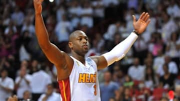 Oct 29, 2013; Miami, FL, USA; Miami Heat shooting guard Dwyane Wade (3) cheers on the crowd before a game against the Chicago Bulls at American Airlines Arena. Mandatory Credit: Steve Mitchell-USA TODAY Sports