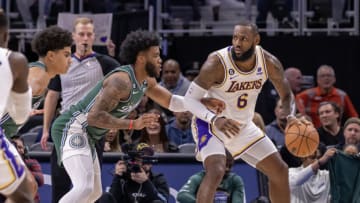 Dec 11, 2022; Detroit, Michigan, USA; Detroit Pistons forward Saddiq Bey (41) defends against Los Angeles Lakers forward LeBron James (6) during the in the first half at Little Caesars Arena. Mandatory Credit: David Reginek-USA TODAY Sports