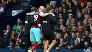 WEST BROMWICH, ENGLAND - SEPTEMBER 16: James Collins of West Ham United goes off injured during the Premier League match between West Bromwich Albion and West Ham United at The Hawthorns on September 16, 2017 in West Bromwich, England. (Photo by Shaun Botterill/Getty Images)