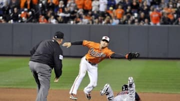 Sep 28, 2013; Baltimore, MD, USA; Boston Red Sox pinch runner Quintin Berry (50) steals second base in the ninth inning as Baltimore Orioles second baseman Brian Roberts (1) does not get the throw in time at Oriole Park at Camden Yards. The Orioles defeated the Red Sox 6-5. Mandatory Credit: Joy R. Absalon-USA TODAY Sports
