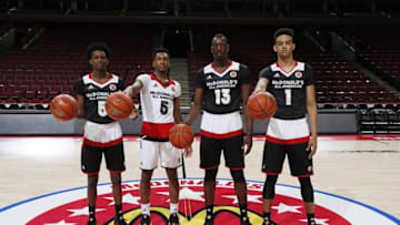 Mar 30, 2016; Chicago, IL, USA; From left to right McDonald's All-Americans De'Aaron Fox (5), Malik Monk (5) Bam Adebayo (13), and Sacha Killeya-Jones (1) who will all be attending the University of Kentucky pose for a group photo before the McDonald's High School All-American Game at the United Center. Mandatory Credit: Brian Spurlock-USA TODAY Sports