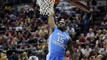 Jan 12, 2013; Tallahassee, FL, USA; North Carolina Tar Heels guard Pj Hairston (15) dunks the ball past Florida State Seminoles guard Michael Snaer (21) and forward Terrance Shannon (2) during the game against the Florida State Seminoles at the Donald L. Tucker Center. Mandatory Credit: Melina Vastola-USA TODAY Sports