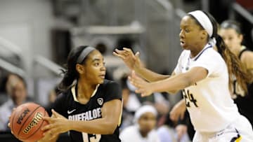 Mar 7, 2015; Seattle, WA, USA; Colorado Buffaloes guard Brecca Thomas (13) goes up against California Golden Bears forward Courtney Range (24) during the semifinals of the Pac-12 Women