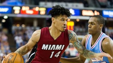 Apr 1, 2016; Sacramento, CA, USA; Miami Heat forward Gerald Green (14) dribbles past Sacramento Kings guard Rajon Rondo (9) in the second quarter at Sleep Train Arena. Mandatory Credit: John Hefti-USA TODAY Sports