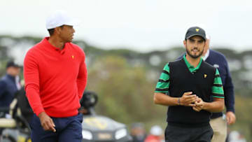 MELBOURNE, AUSTRALIA - DECEMBER 15: Playing Captain Tiger Woods of the United States team and Abraham Ancer of Mexico and the International team walk on the ninth hole during Sunday Singles matches on day four of the 2019 Presidents Cup at Royal Melbourne Golf Course on December 15, 2019 in Melbourne, Australia. (Photo by Warren Little/Getty Images)