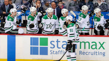 WINNIPEG, MB - MARCH 25: Tyler Seguin #91 of the Dallas Stars celebrates his third period goal against the Winnipeg Jets with teammates at the bench at the Bell MTS Place on March 25, 2019 in Winnipeg, Manitoba, Canada. (Photo by Jonathan Kozub/NHLI via Getty Images)