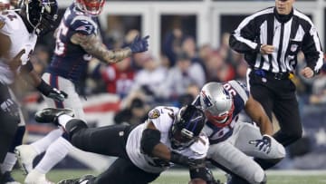 Dec 12, 2016; Foxborough, MA, USA; New England Patriots defensive end Trey Flowers (98) and Baltimore Ravens offensive tackle Ronnie Stanley (79) reach for a loose ball during the first half at Gillette Stadium. Mandatory Credit: Stew Milne-USA TODAY Sports