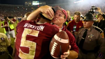 TALLAHASSEE, FL - OCTOBER 18: Head coach Jimbo Fisher of the Florida State Seminoles hugs Jameis Winston #5 after defeating the Notre Dame Fighting Irish 31-27 in their game at Doak Campbell Stadium on October 18, 2014 in Tallahassee, Florida. (Photo by Streeter Lecka/Getty Images)