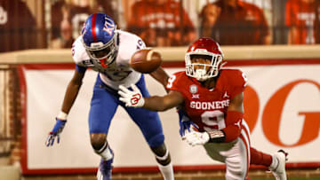 Nov 7, 2020; Norman, Oklahoma, USA; Oklahoma Sooners cornerback D.J. Graham (9) defends a ball intended for Kansas Jayhawks wide receiver Steven McBride (19) during the second half at Gaylord Family-Oklahoma Memorial Stadium. Mandatory Credit: Kevin Jairaj-USA TODAY Sports