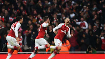 LONDON, ENGLAND - NOVEMBER 18: Shkodran Mustafi of Arsenal celebrates with team mates after scoring his sides first goal during the Premier League match between Arsenal and Tottenham Hotspur at Emirates Stadium on November 18, 2017 in London, England. (Photo by Mike Hewitt/Getty Images)