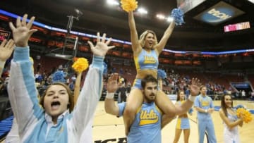 Mar 19, 2015; Louisville, KY, USA; UCLA Bruins cheerleaders celebrate after the UCLA Bruins defeated the Southern Methodist Mustangs 60-59 in the second round of the 2015 NCAA Tournament at KFC Yum! Center. Mandatory Credit: Brian Spurlock-USA TODAY Sports