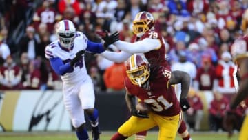 Dec 20, 2015; Landover, MD, USA; Washington Redskins running back Matt Jones (31) carries the ball against the Buffalo Bills during the first half at FedEx Field. Mandatory Credit: Brad Mills-USA TODAY Sports