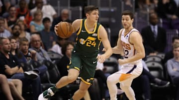 PHOENIX, ARIZONA - APRIL 03: Grayson Allen #24 of the Utah Jazz handles the ball guarded by Jimmer Fredette #32 of the Phoenix Suns during the first half of the NBA game at Talking Stick Resort Arena on April 03, 2019 in Phoenix, Arizona. (Photo by Christian Petersen/Getty Images)