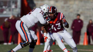 BLACKSBURG, VA - NOVEMBER 26: Virginia Tech (43) Seth Dooley (DE) attempts to elude Virginia (72) Eric Smith (RT) during an NCAA football game between the Virginia Tech Hokies and the Virginia Cavaliers on November 26, 2016, at Lane Stadium in Blacksburg, VA. Virginia Tech defeated Virginia 52-10 (Photo by Lee Coleman/Icon Sportswire via Getty Images)