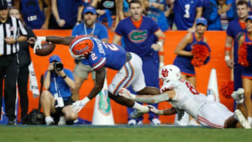 Sep 3, 2022; Gainesville, Florida, USA;Florida Gators running back Montrell Johnson Jr. (2) runs with the ball as DUPLICATE***Utah Utes safety Cole Bishop (8)***Utah Utes quarterback Brandon Rose (8) stops him short of the goal line during the first quarter at Steve Spurrier-Florida Field. Mandatory Credit: Kim Klement-USA TODAY Sports