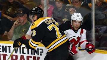 Sep 20, 2015; Providence,RI, USA; Boston Bruins defenseman Brandon carlo (73) checks New Jersey Devils left wing Tuomo Ruutu (15) against the boards during the first period at the Dunkin Donuts Center. Mandatory Credit: Mark L. Baer-USA TODAY Sports