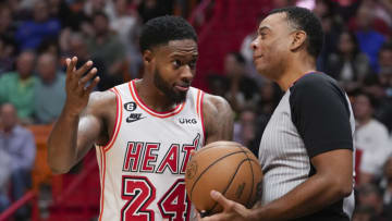 Haywood Highsmith #24 of the Miami Heat talks with referee Karl Lane #77 during a time out (Photo by Eric Espada/Getty Images)
