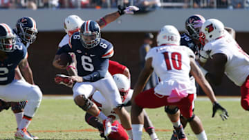 Oct 29, 2016; Charlottesville, VA, USA; Virginia Cavaliers quarterback Kurt Benkert (6) runs with the ball as Louisville Cardinals cornerback Jaire Alexander (10) chases in the second quarter at Scott Stadium. Mandatory Credit: Geoff Burke-USA TODAY Sports