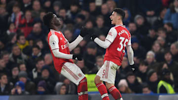 LONDON, ENGLAND - JANUARY 21: Gabriel Martinelli of Arsenal celebrates with teammate Bukayo Saka after scoring his team's first goal during the Premier League match between Chelsea FC and Arsenal FC at Stamford Bridge on January 21, 2020 in London, United Kingdom. (Photo by Harriet Lander/Copa/Getty Images)