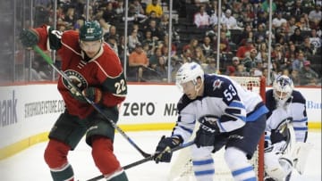 Sep 27, 2015; Saint Paul, MN, USA: Minnesota Wild forward Nino Niederreiter (22) and Winnipeg Jets defenseman Jan Kostalek go after a loose puck in the corner during the second period at Xcel Energy Center. Mandatory Credit: Marilyn Indahl-USA TODAY Sports