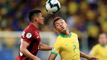 SALVADOR, BRAZIL - JUNE 18: David Neres of Brazil heads the ball against Ronald Hernandez of Venezuela during the Copa America Brazil 2019 group A match between Brazil and Venezuela at Arena Fonte Nova on June 18, 2019 in Salvador, Brazil. (Photo by Buda Mendes/Getty Images)