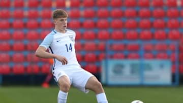 VOLUNTARI, ROMANIA - OCTOBER 30: Lewis Gibson of England passes the ball during the UEFA Under-17 EURO Qualifier between U17 Austria and U17 England on October 30, 2016 at Anghel Iordanescu stadium in Voluntari, Romania. (Photo by Ronny Hartmann/Getty Images)