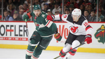 ST. PAUL, MN - NOVEMBER 20: Nino Niederreiter #22 of the Minnesota Wild and Steven Santini #16 of the New Jersey Devils skate to the puck during the game at the Xcel Energy Center on November 20, 2017 in St. Paul, Minnesota. (Photo by Bruce Kluckhohn/NHLI via Getty Images)