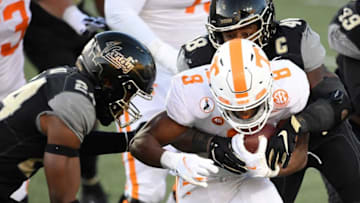 Tennessee running back Ty Chandler (8) rushes through the Vanderbilt defense during the second quarter at Vanderbilt Stadium Saturday, Dec. 12, 2020 in Nashville, Tenn.Gw55838