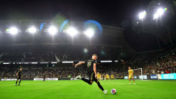 Aug 8, 2023; Los Angeles, CA, USA; Los Angeles FC midfielder Mateusz Bogusz (19) takes a free kick against Real Salt Lake during the second half at BMO Stadium. Mandatory Credit: Gary A. Vasquez-USA TODAY Sports