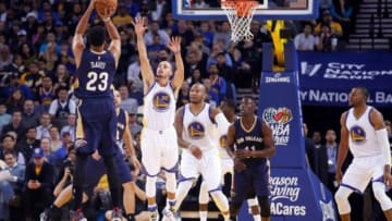 Golden State Warriors guard Stephen Curry (30) defends the shot by New Orleans Pelicans forward Anthony Davis (23) during the first quarter at Oracle Arena. Mandatory Credit: Kelley L Cox-USA TODAY Sports